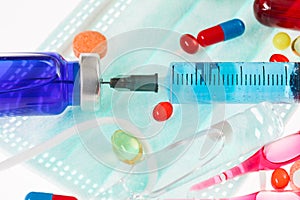 Pills, sterile mask, ampoules and syringe