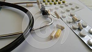 pills stethoscope, pharmaceutical medication slow-motion pharmacology