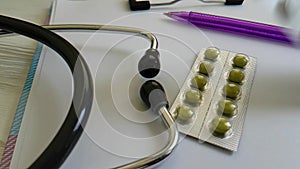 Pills stethoscope, slow-motion healthcare treatment shooting pharmacology professional
