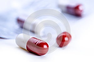 Pills. Tablets. Capsule. Heap of pills. Medical background. Close-up of pile of red white tablets - capsule. Pills and tablets.