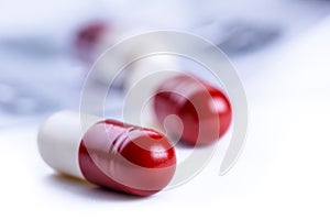 Pills. Tablets. Capsule. Heap of pills. Medical background. Close-up of pile of red white tablets - capsule. Pills and tablets.