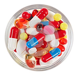 Pills, tablets and drugs heap in glass