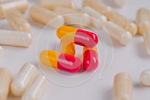 Pills, tablets, drugs, meds, medications on white surface - close up