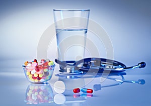 Pills and tablets macro still life on white blue
