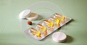 Pills, tabs and omega 6 evening primrose oil capsules. Healthcare concept