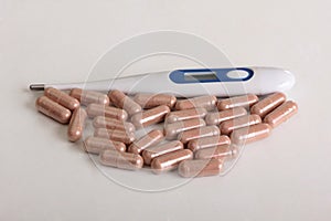 Pills and thermometer two