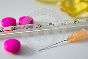 Pills and thermometer