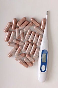 Pills and thermometer three