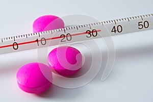 Pills and thermometer
