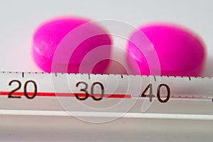 Pills and thermometer