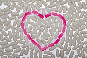 Pills, vitamins on white background