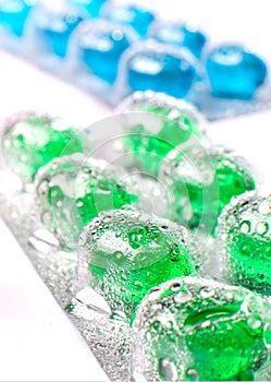 Pills with water droplets
