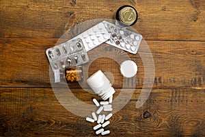 Pills white, blister pack and different medicine bottles