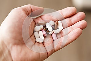 Pills in woman hand, drug addiction