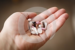 Pills in woman hand, drug addiction