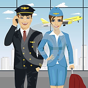 Pilot and air hostess in uniform at airport