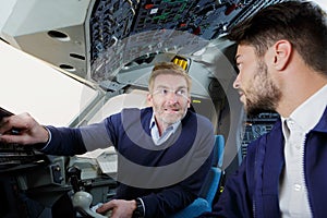 Pilot and apprentice in cockpit