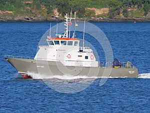 A pilot boat brings a pilot back to Falmouth Cornwall