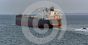 Pilot boat and bulk carrier cargo ship