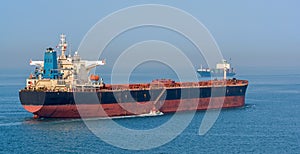 Pilot boat and bulk carrier cargo ship