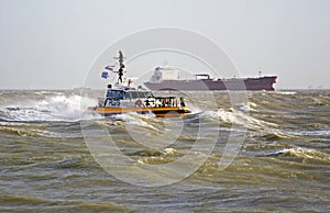 A pilot boat in the storm