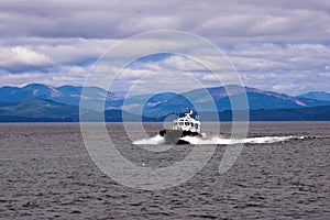 Pilot boat on waves at mouth of Columbia River