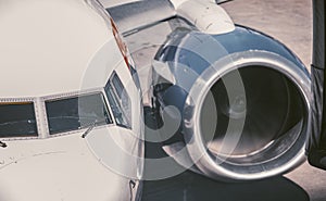 Pilot in the cockpit of a twin-engine passenger jet starting the engines for flight