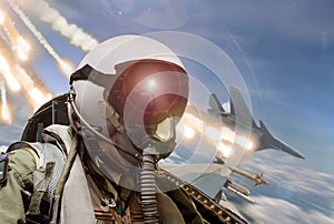 Pilot cockpit view during air to air combat with missiles flares chaff being deployed