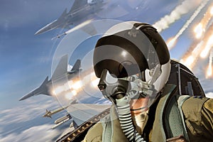 Pilot cockpit view during air to air combat with missiles flares chaff being deployed