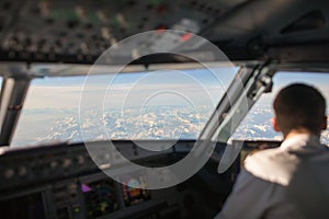 Pilot in a commercial airliner airplane flight cockpit