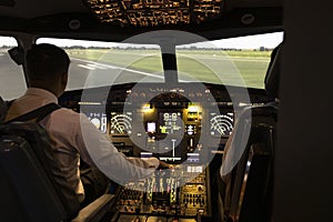 Pilot and Copilot in Aircraft Simulator with Controls