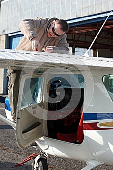 Pilot doing pre-flight checking