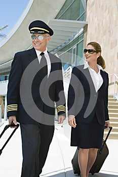Pilot And Flight Attendant Outside Building