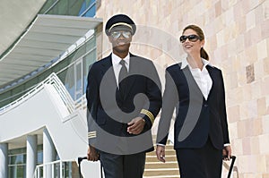 Pilot And Flight Attendant Outside Building