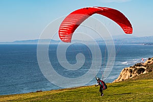 Pilot Heads Toward Edge of Cliff at Torrey Pines Gliderport in San Diego