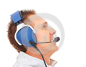 Pilot with headset looking aside photo