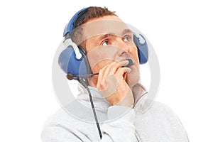 Pilot with headset looking aside