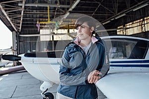 Pilot leaning on a light aircraft