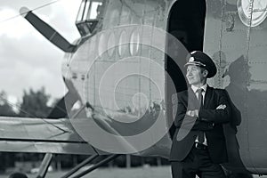 Pilot near vintage aircraft