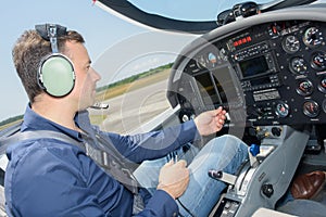pilot operating cockpit controls