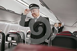 Pilot in passenger cabin of modern airplane jet