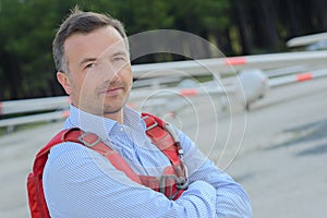 Pilot posing with glider