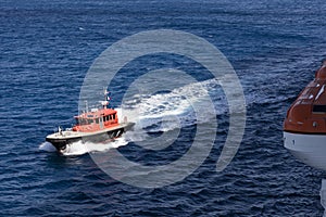 A pilot rescue boat and lifeboats