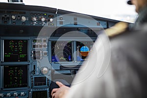 Pilot`s hand accelerating on the throttle in airplane flight cockpit during takeoff