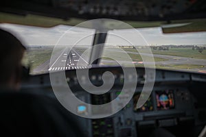 Pilot`s hand accelerating on the throttle in airplane flight cockpit during takeoff