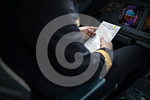 Pilot`s hand accelerating on the throttle in airplane flight cockpit during takeoff