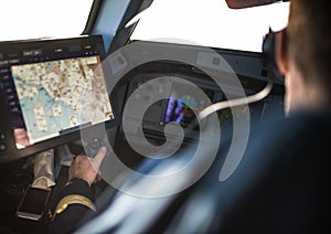 Pilot`s hand accelerating on the throttle in airplane flight cockpit during takeoff