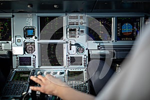 Pilot`s hand accelerating on the throttle in  a commercial airliner