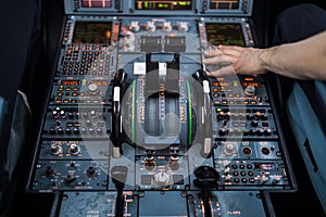 Pilot`s hand accelerating on the throttle in  a commercial airliner
