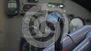 The pilot`s hand on the helm of the aircraft